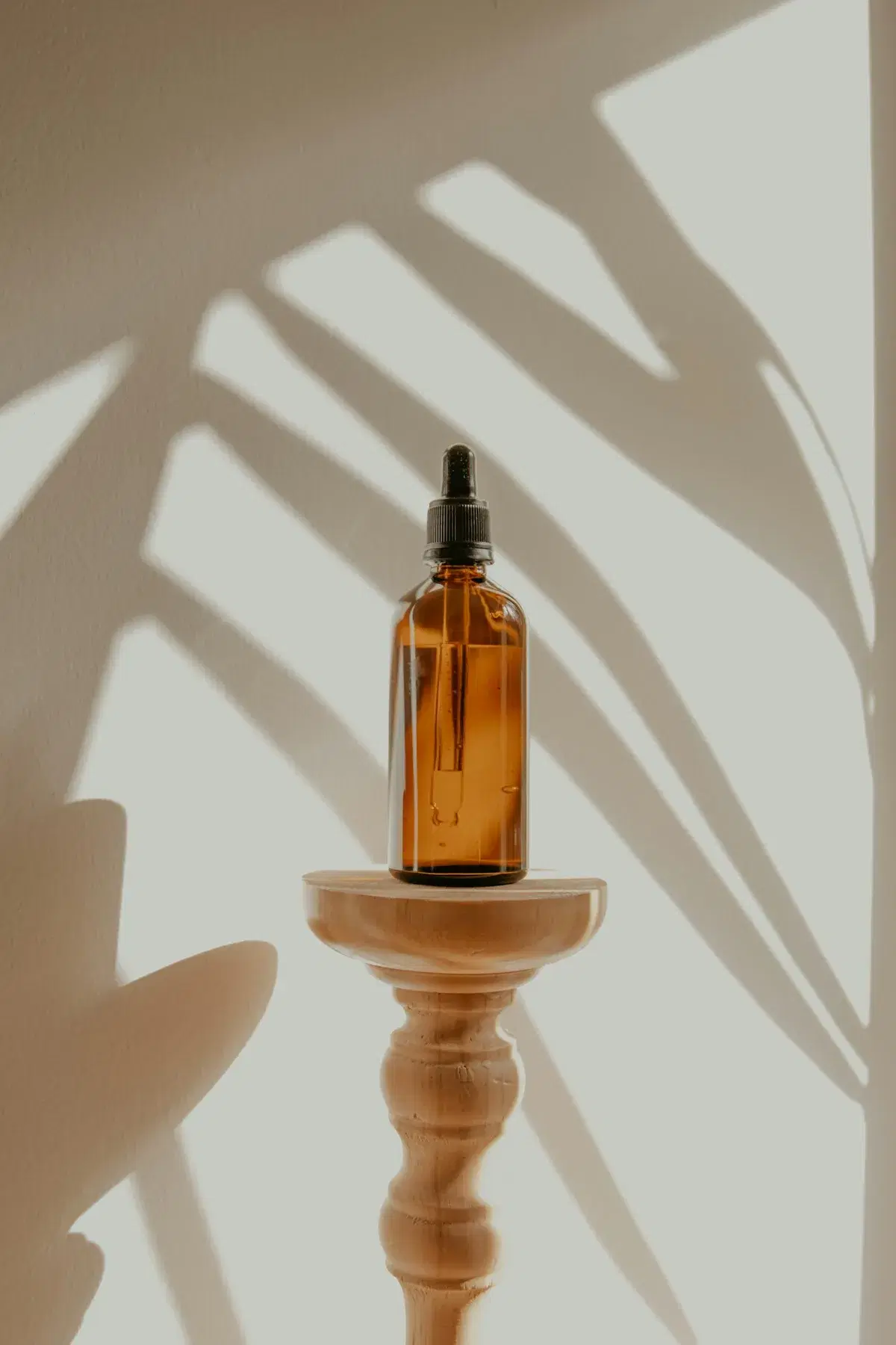 Amber skin-care bottle in natural light